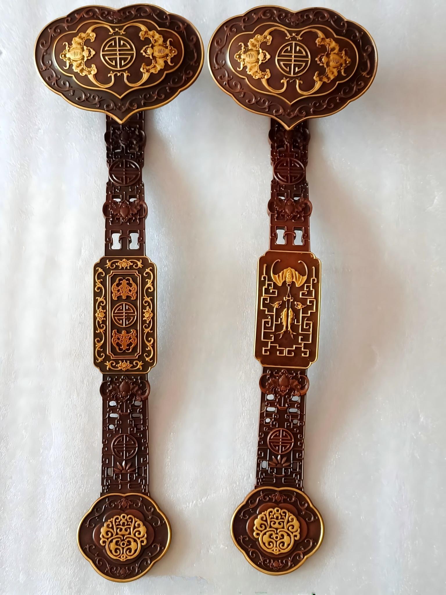 A pair of Qing Dynasty Qianlong period bronze ruyi scepters inlaid with gold. (1 of 9)