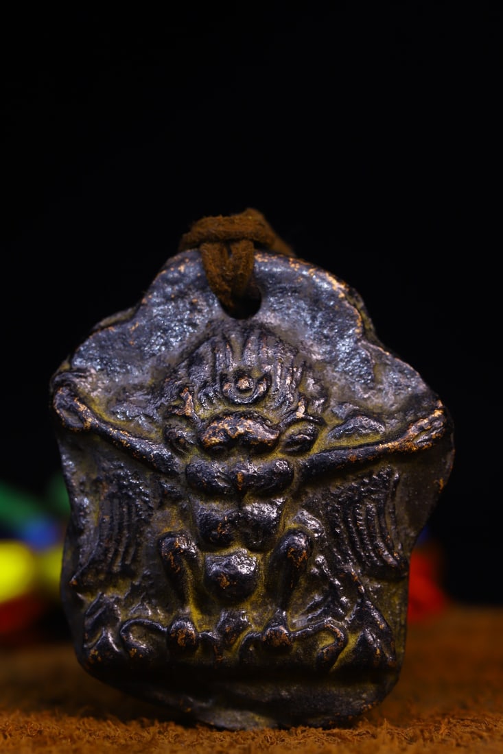 Copper-bodied, hand-hammered and engraved Buddha amulets: This copper-bodied, hand-hammered and engraved Buddha amulet measures 5.5 cm in height, 4.6 cm in width, and weighs approximately 120 g. Provenance:Private collection of a retired doctor in