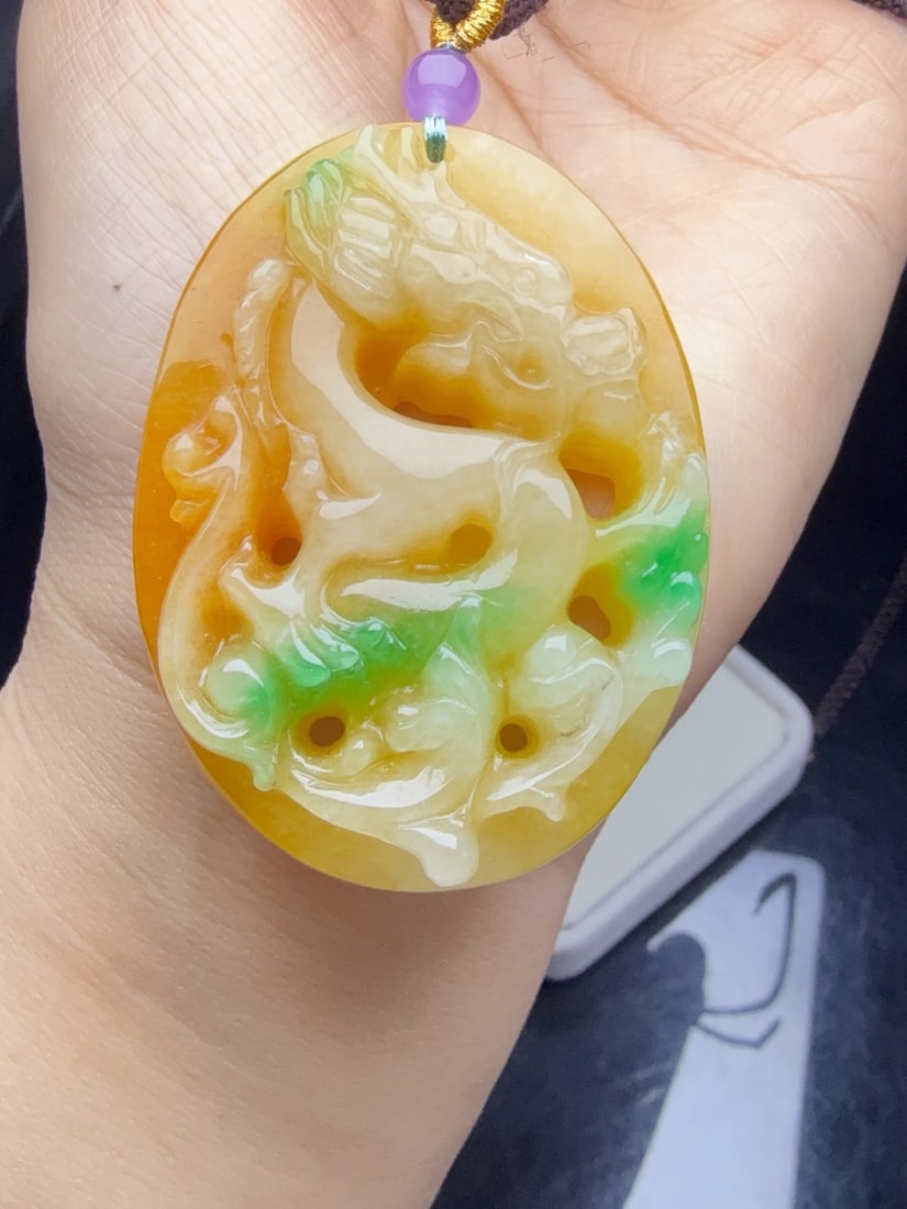 Jadeite Tricolor "Dragon Pendant": This tricolor jadeite "dragon pendant" is of top-quality, with fine texture, exquisite three-dimensionality, thick and full appearance, and is flawless without any cracks. Provenance:from the collecti