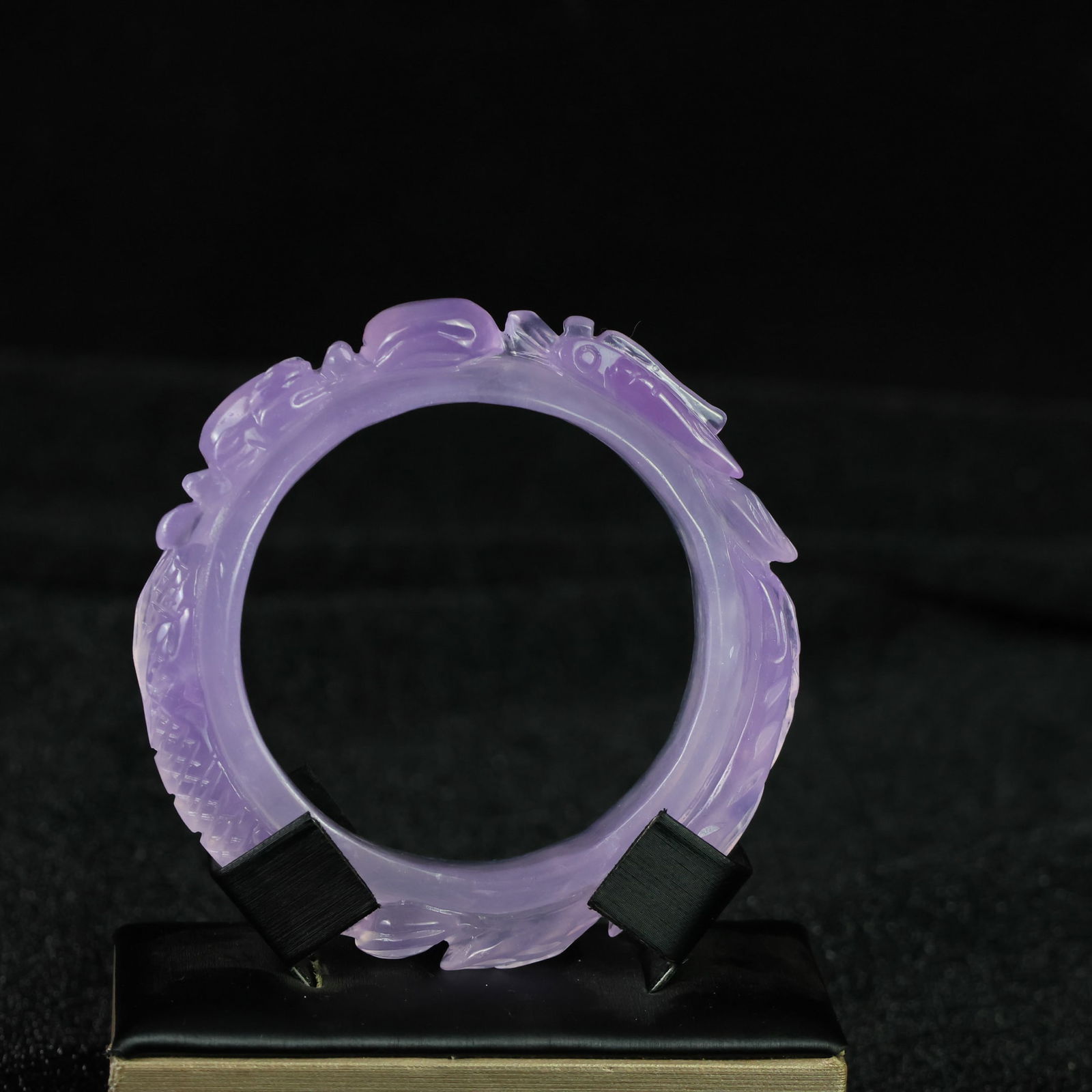 Perfectly crafted high-grade ice crystal jadeite bangle with exquisite carving.: This exquisitely carved high-grade icy jadeite bangle boasts a pure, rich, clean, and translucent base with strong fluorescence and exceptional rigidity. Its icy, luminous appearance and perfect trans