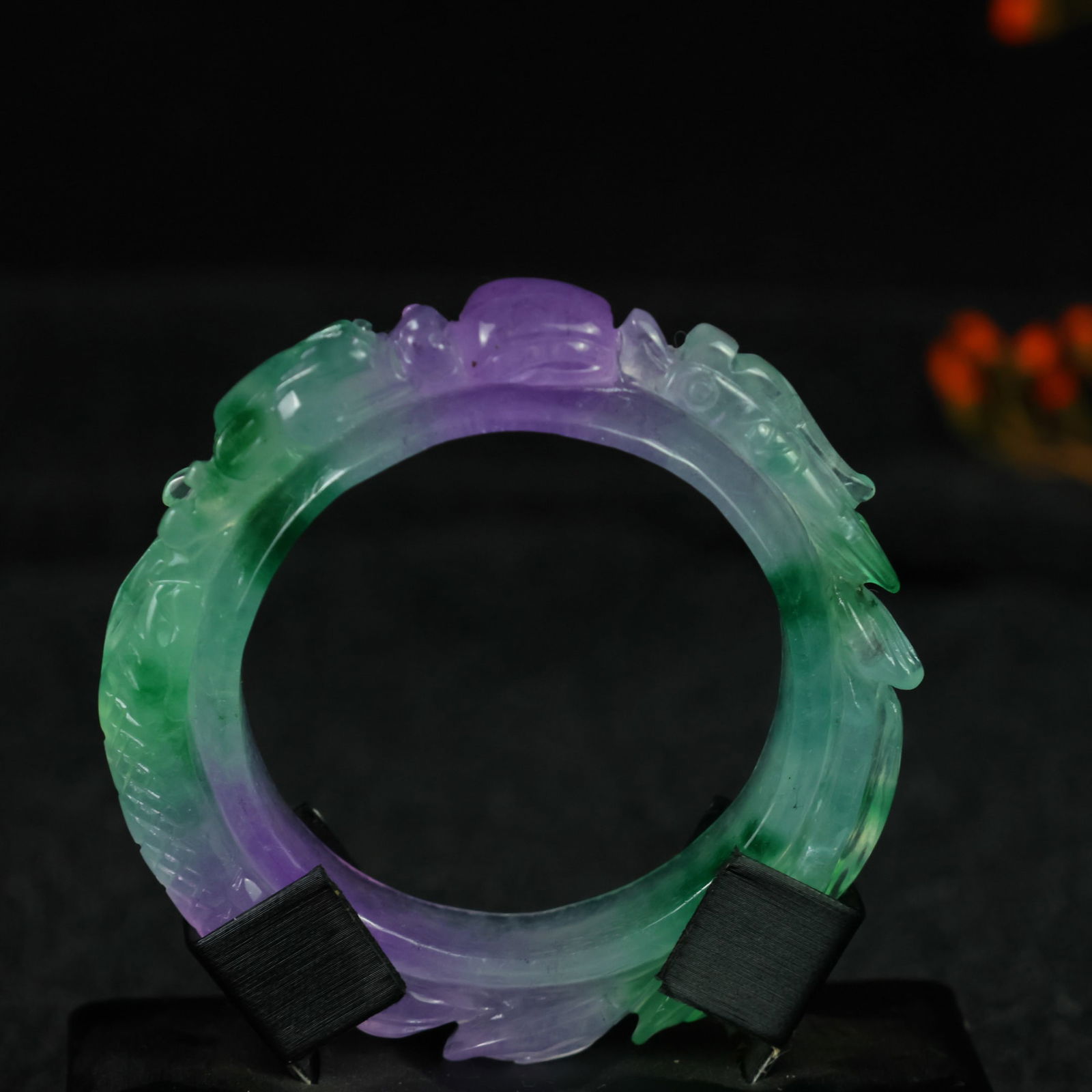 Perfectly crafted high-grade ice crystal jadeite bangle with exquisite carving.: This exquisitely carved high-grade icy jadeite bangle boasts a pure, rich, clean, and translucent base with strong fluorescence and exceptional rigidity. Its icy, luminous appearance and perfect trans
