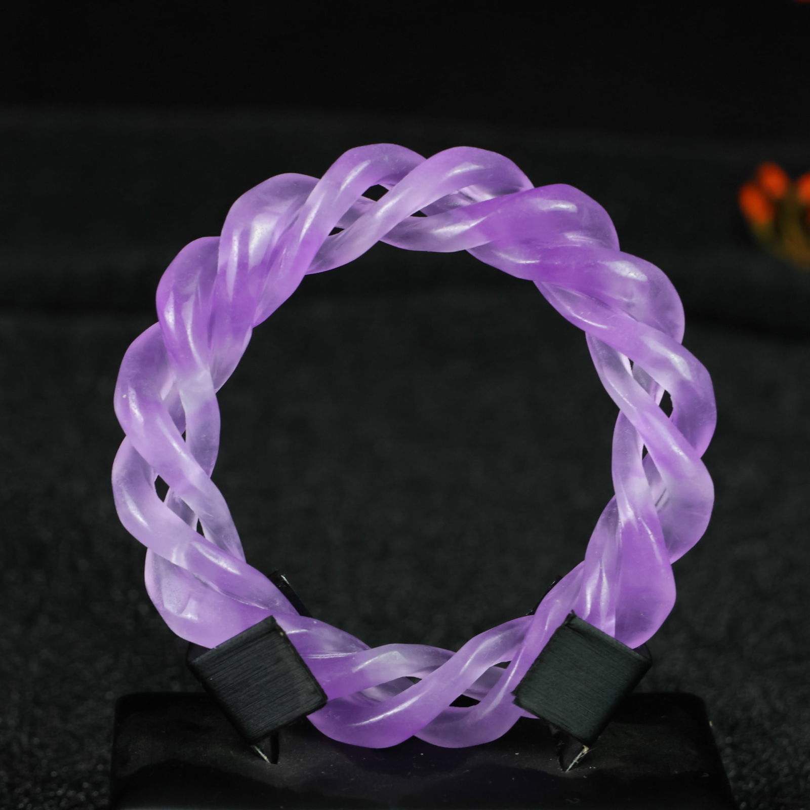 Perfectly crafted high-grade ice crystal jadeite bangle with exquisite carving.: This exquisitely carved high-grade icy jadeite bangle boasts a pure, rich, clean, and translucent base with strong fluorescence and exceptional rigidity. Its icy, luminous appearance and perfect trans