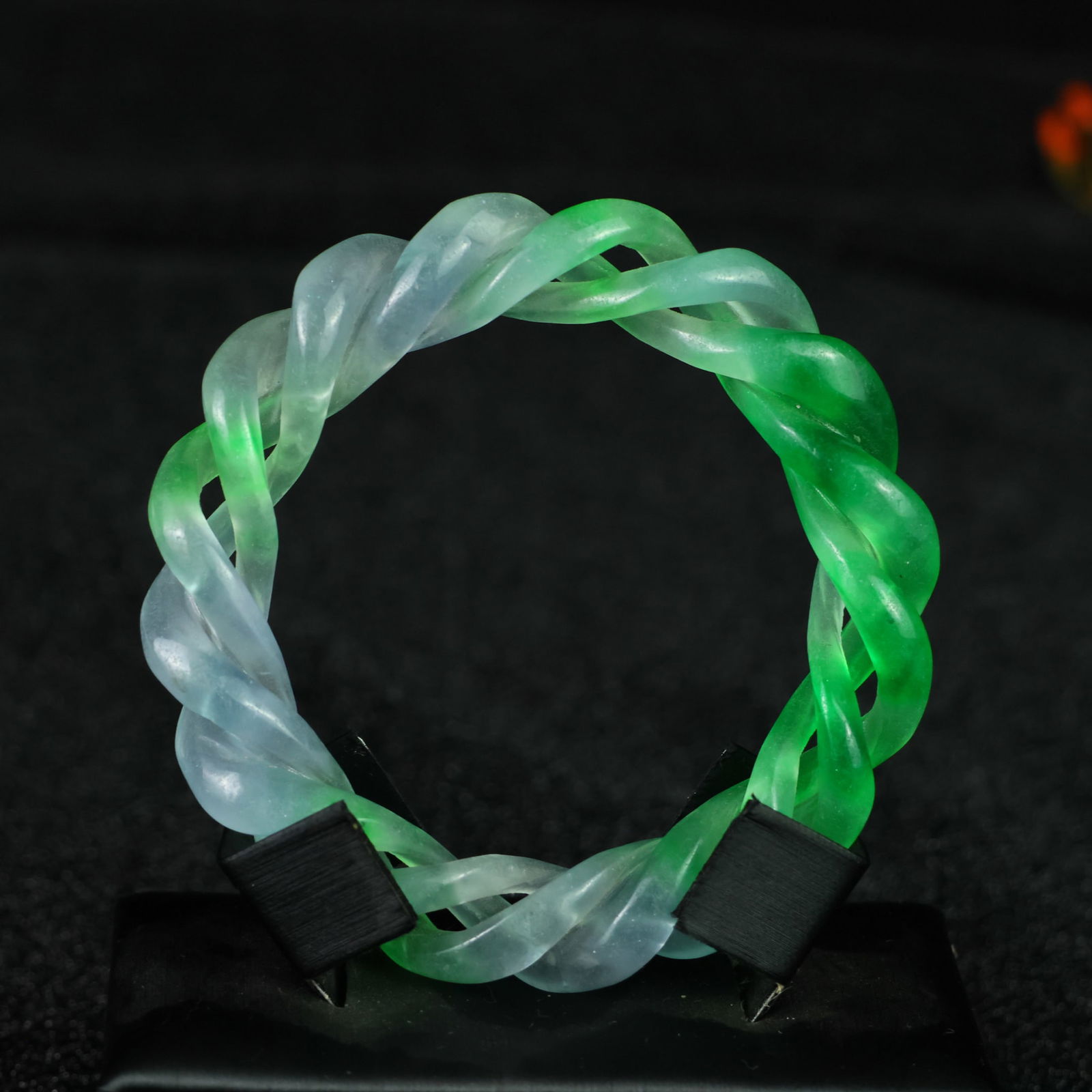 Perfectly crafted high-grade ice crystal jadeite bangle with exquisite carving.: This exquisitely carved high-grade icy jadeite bangle boasts a pure, rich, clean, and translucent base with strong fluorescence and exceptional rigidity. Its icy, luminous appearance and perfect trans
