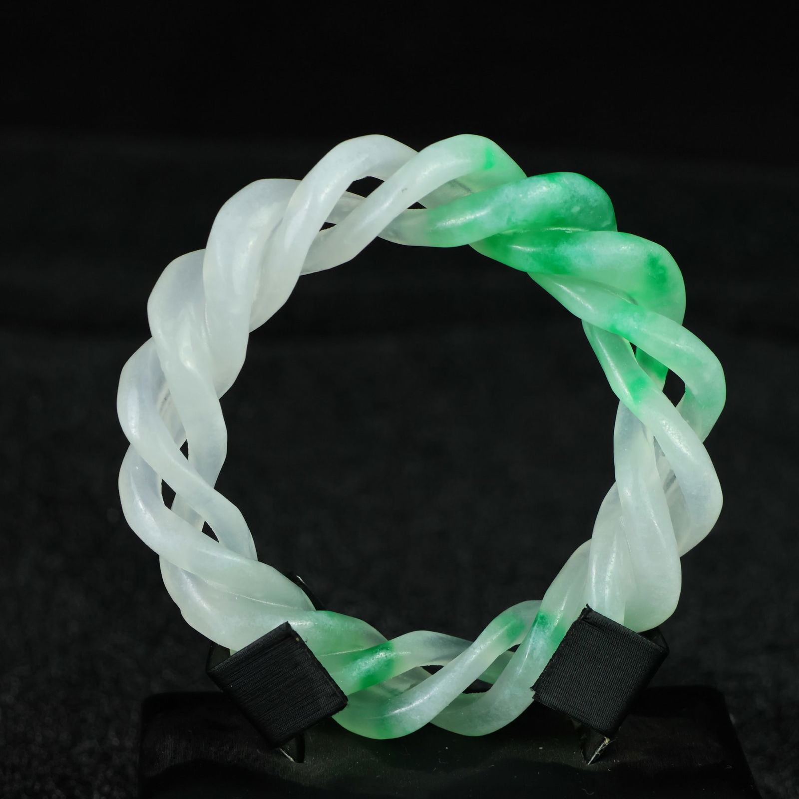 Perfectly crafted high-grade ice crystal jadeite bangle with exquisite carving.: This exquisitely carved high-grade icy jadeite bangle boasts a pure, rich, clean, and translucent base with strong fluorescence and exceptional rigidity. Its icy, luminous appearance and perfect trans