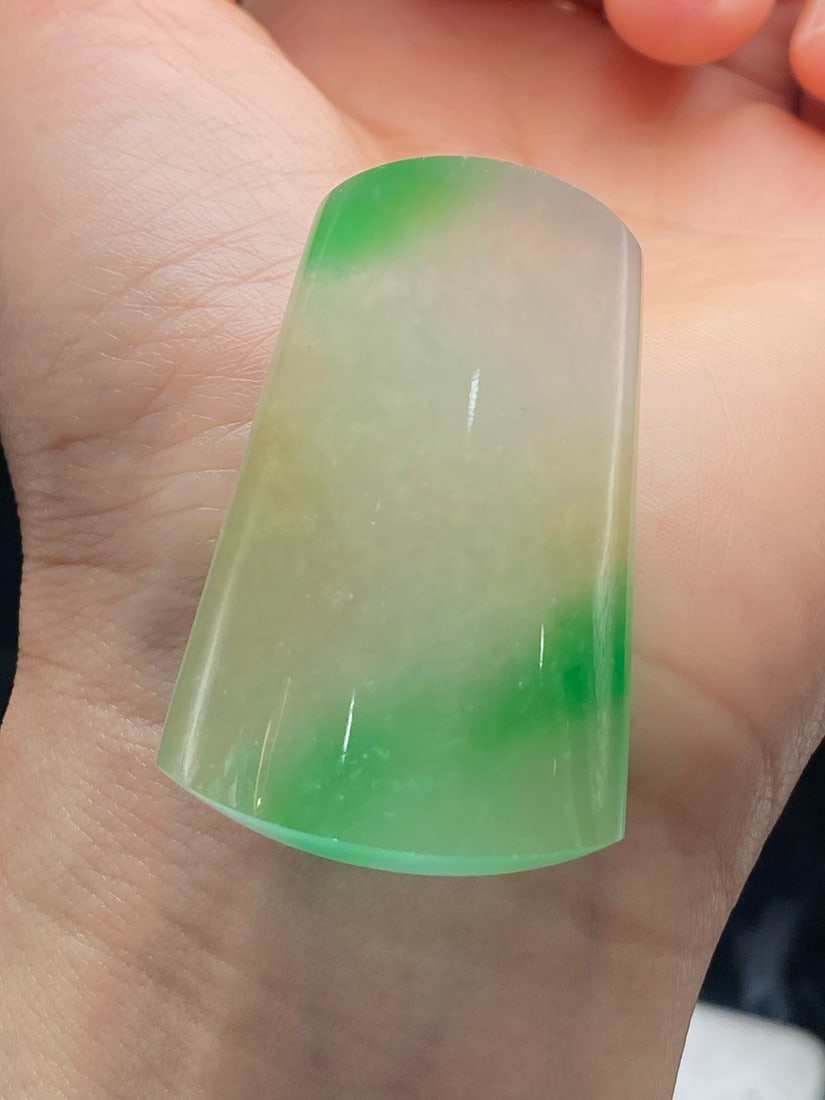 Jadeite of icy type with floating green "Nothing to Worry" pendant: This jadeite pendant, made of icy green with floating green hues, is translucent and lustrous, finely carved, thick and full, with top-notch texture and clarity. Provenance:Private collection, Liverpo