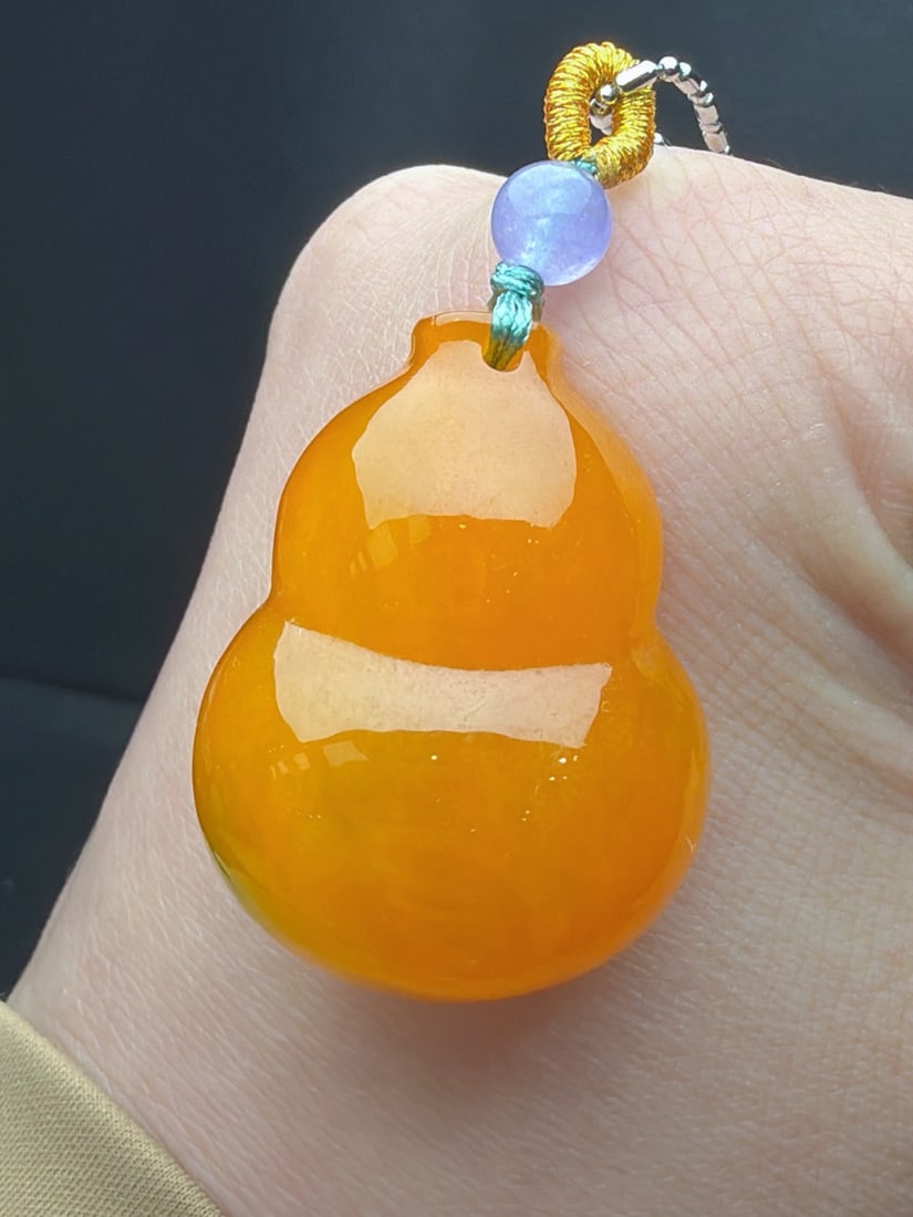 Jadeite Gourd with Icy Yellow Jadeite: A jadeite gourd of glutinous, icy type with yellow jadeite; the material is delicate, finely carved, and thick and full. Provenance:Private collection, Liverpool, The United Kingdom. Our cooperative l