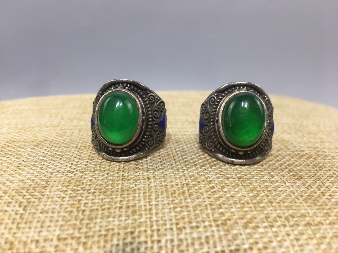 Sterling silver ring set with jade: A pure silver ring set with jade, handcrafted with exquisite workmanship, a rich patina, a unique shape, and in excellent condition. Provenance:Private collection, Liverpool, The United Kingdom. Our c