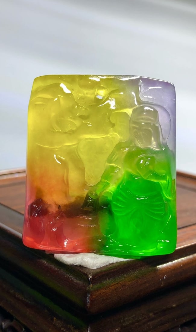 High-quality, multi-colored jadeite three-dimensional relief landscape Guanyin pendant: High-quality, multi-colored jadeite pendant with a three-dimensional relief carving of a landscape and Guanyin (Avalokitesvara) in icy blue. Provenance:Private collection from a professor in The Unive