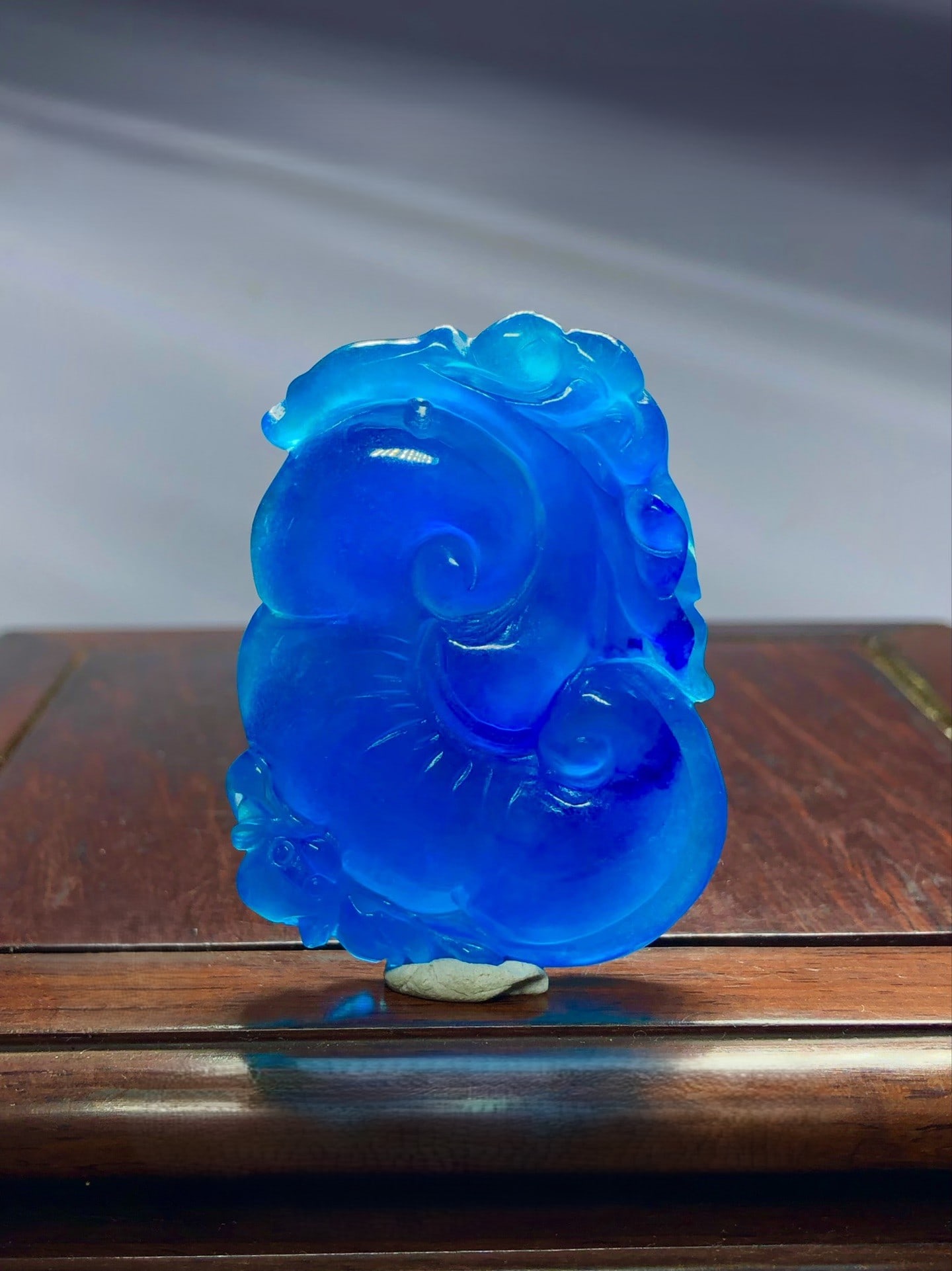 High-ice ocean blue jadeite pendant with auspicious symbolism of good fortune and longevity.: This high-quality, ocean-blue jadeite pendant features auspicious symbols of good fortune and longevity. Made from premium material, it boasts a lustrous, icy blue hue, full color and clarity, and a b