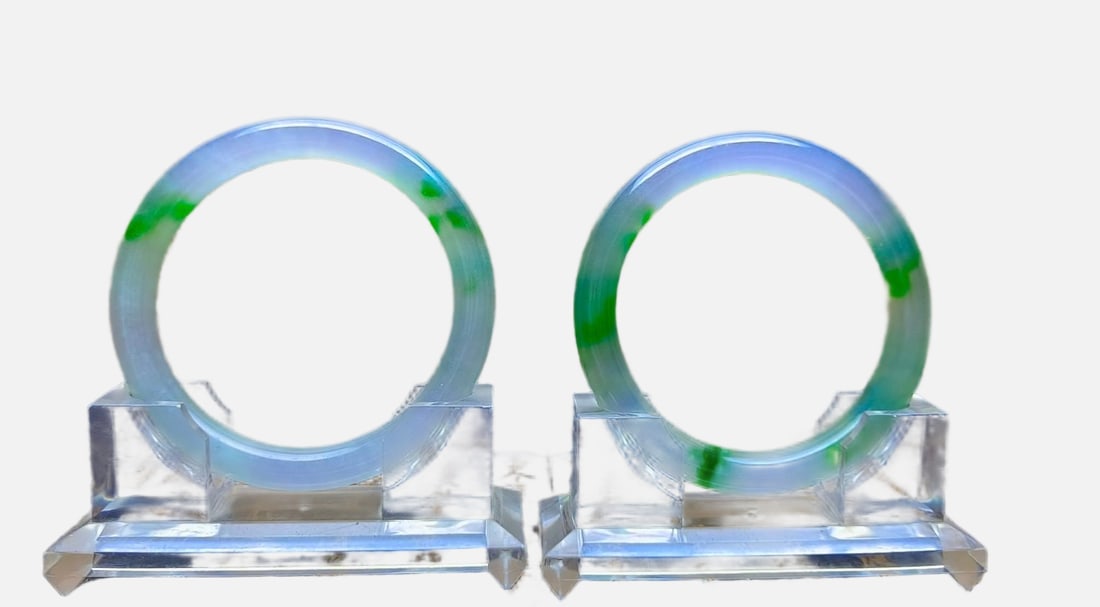 A pair of top-grade dragon stone jadeite bracelets with floating flowers (1 of 7)