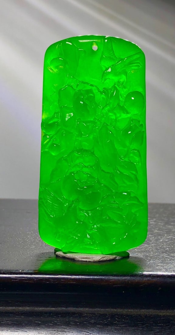 Dragon Stone Type High-Ice Jadeite Frosted Floral and Bird Pendant: This is a high-quality, icy jadeite pendant with frosted floral and bird design. Made from superior, translucent, and lustrous material, it features full color and exquisite three-dimensional relief c