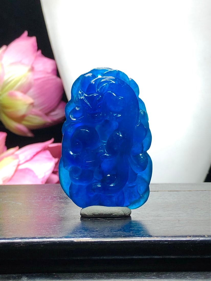 High-quality icy blue jadeite dragon pendant with auspicious symbolism and good fortune.: High-grade icy ocean blue jadeite dragon pendant, a complete handmade 3D carving, with an overall icy and translucent appearance. Provenance:Private collection, Manchester, The United Kingdom. Our coo