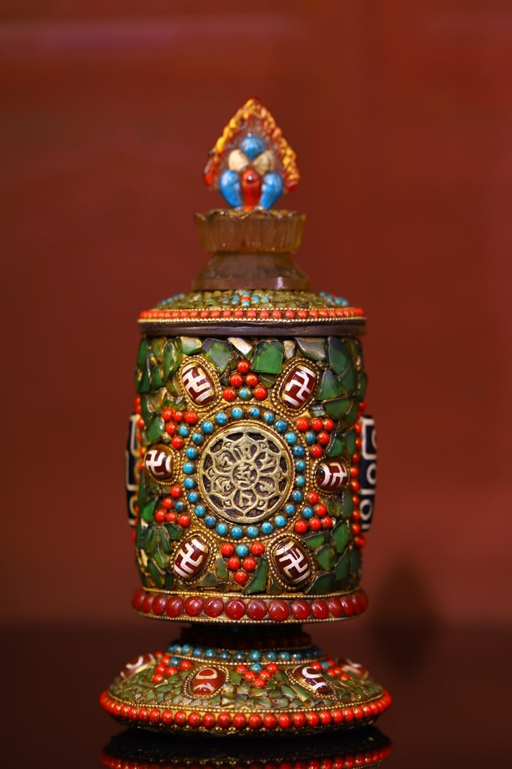 Tibetan crystal carving and inlaid jewel treasure jar: A Tibetan-style crystal carving, inlaid with dzi beads, and a gemstone jar, 22 cm high, 9.5 cm wide, and weighing approximately 1060 g. Provenance:from the collection of George Stopher, Kent, purchase