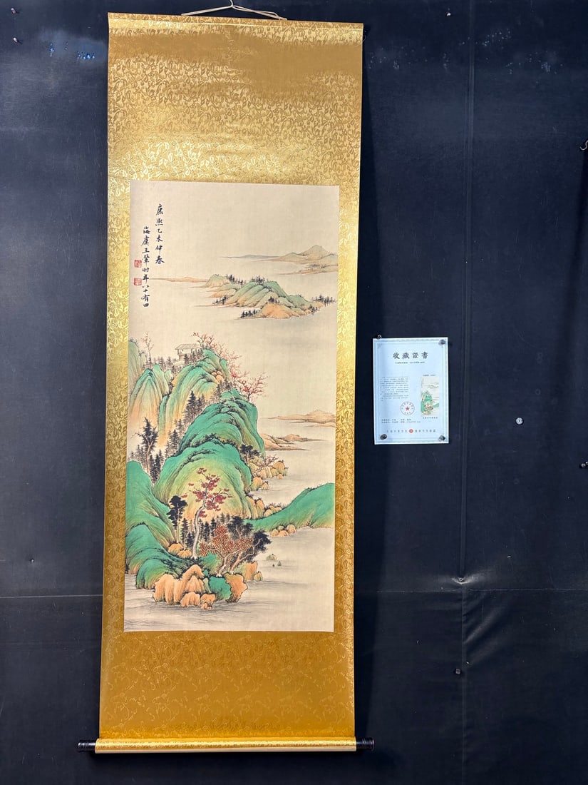 Springtime warmth over Wang Hui's lakes and mountains: A four-foot anti-counterfeiting certificate for a hanging scroll painting by Wang Hui, depicting a landscape in springtime. The painting is on Xuan paper and is mounted. Dimensions: approximately 200c