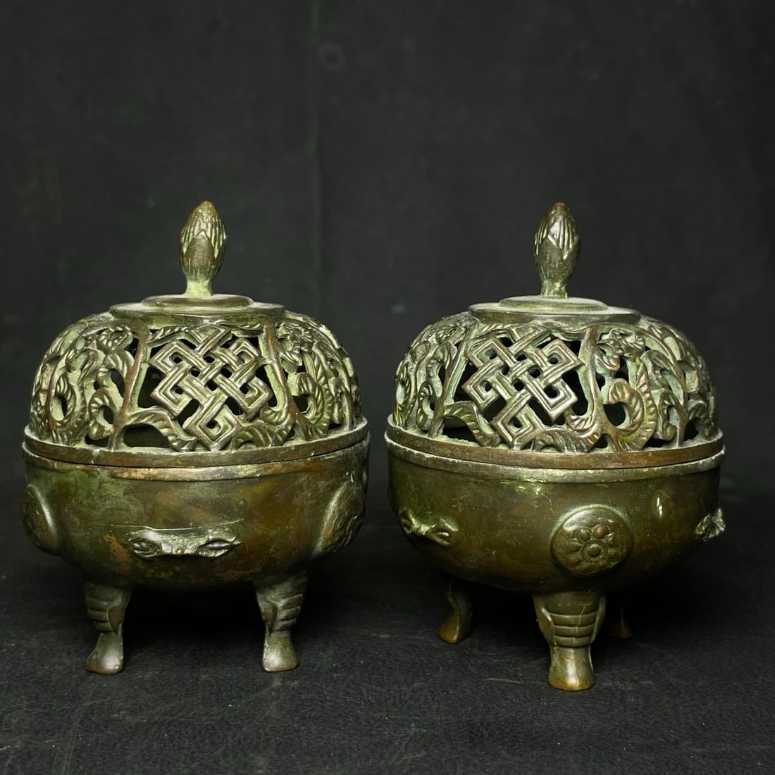 A pair of bronze incense burner ornaments: A pair of bronze incense burner ornaments, each measuring 6.8 cm in diameter and 9 cm in height. Provenance:From an old private collection in Cotswold, United Kingdom.? Our cooperative logistics