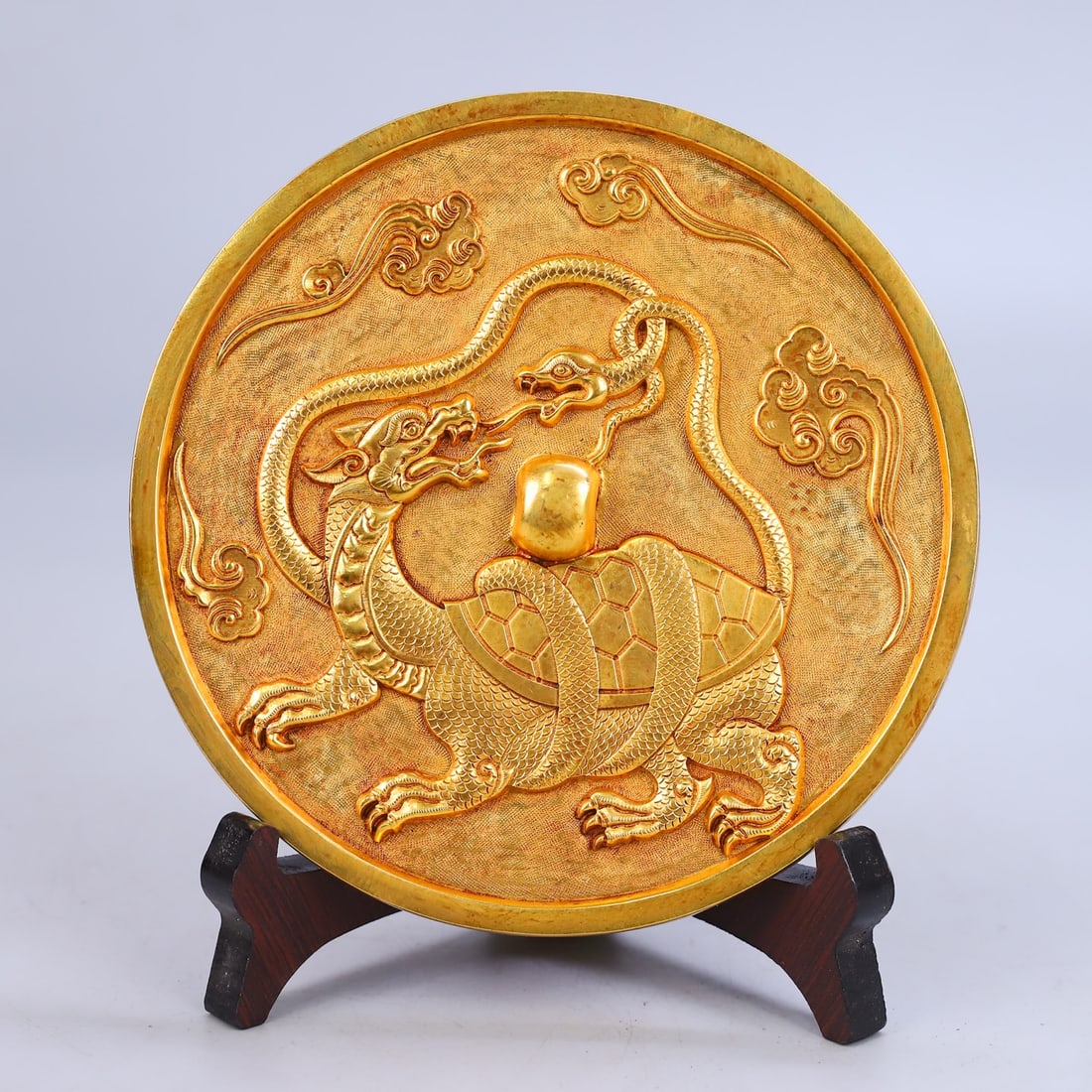 Treasured Collection of Xuanwu Mirror with Relief Engraving: A rare collection of Xuanwu (Black Tortoise) relief-engraved mirror, 14.5cm in diameter and weighing 890g. Provenance:Private collection from a professor in University of Cambridge. Our cooperative lo
