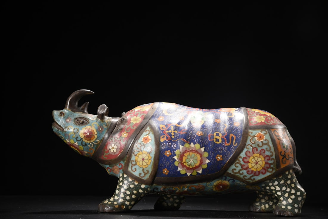 Cloisonne Rhinoceros Ornament: Cloisonne rhinoceros ornament, 41cm long, 14cm wide, 21cm high, weighing 6535g. Provenance:Private collection from a professor in University of Cambridge. Our cooperative logistics services provider e