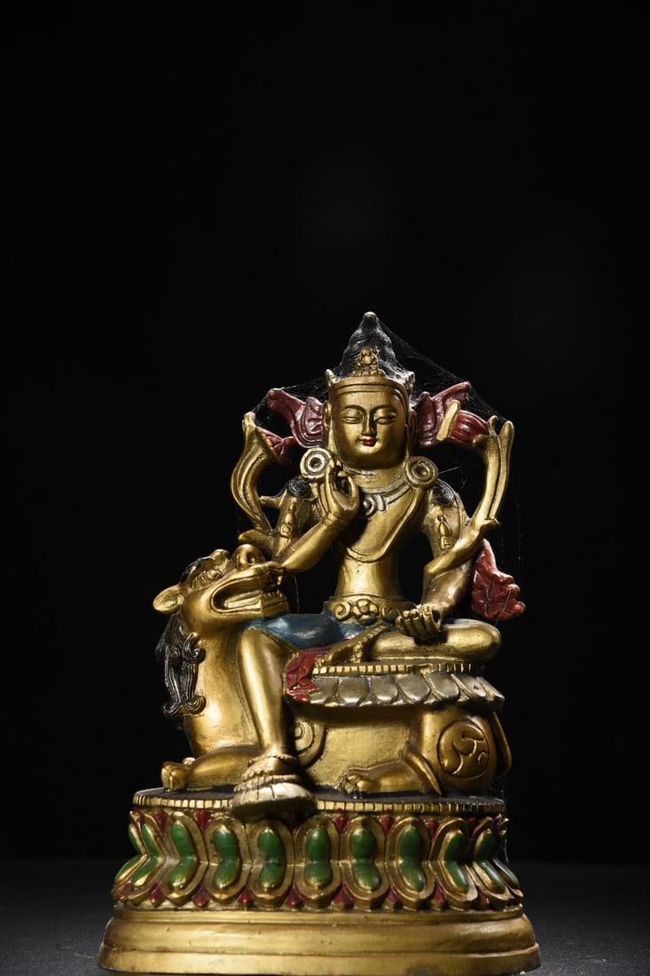 Copper Painted Manjushri Bodhisattva Statue: A bronze painted statue of Manjushri Bodhisattva, 23cm high, 15cm wide, 10cm thick, and weighing 1545g. Provenance:A notable private collector in Kensington, London, United Kingdom. Our cooperative lo
