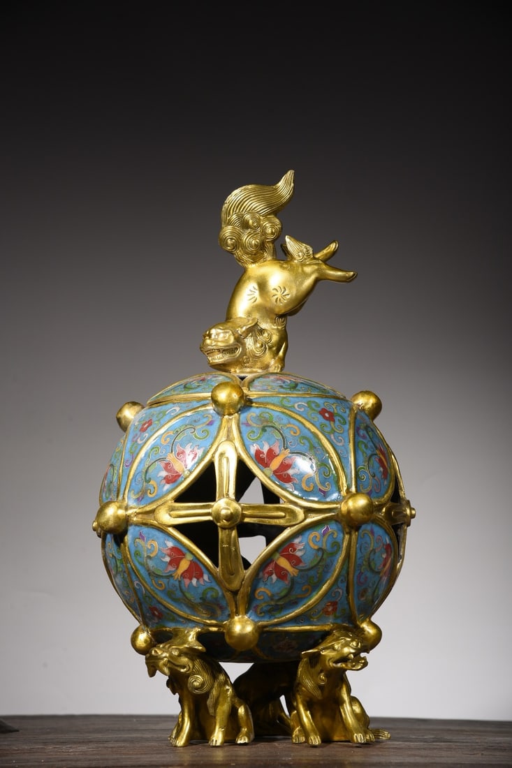 Copper-bodied cloisonne lion and embroidered ball incense burner: A cloisonne enamel lion-and-ball incense burner with a copper body, 44cm high, approximately 23cm in diameter, 14cm in mouth diameter, and weighing 6005g. Provenance:from the collection of George Stop