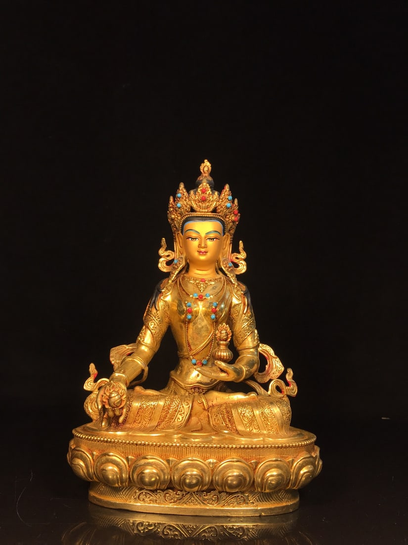 Nepalese gold-painted face Ksitigarbha Bodhisattva statue: This is a Nepalese-style gold-painted Ksitigarbha Bodhisattva statue. It is exquisitely crafted with a thick patina. It measures 14cm in width, 21.5cm in height, and 9cm in thickness, and weighs appro