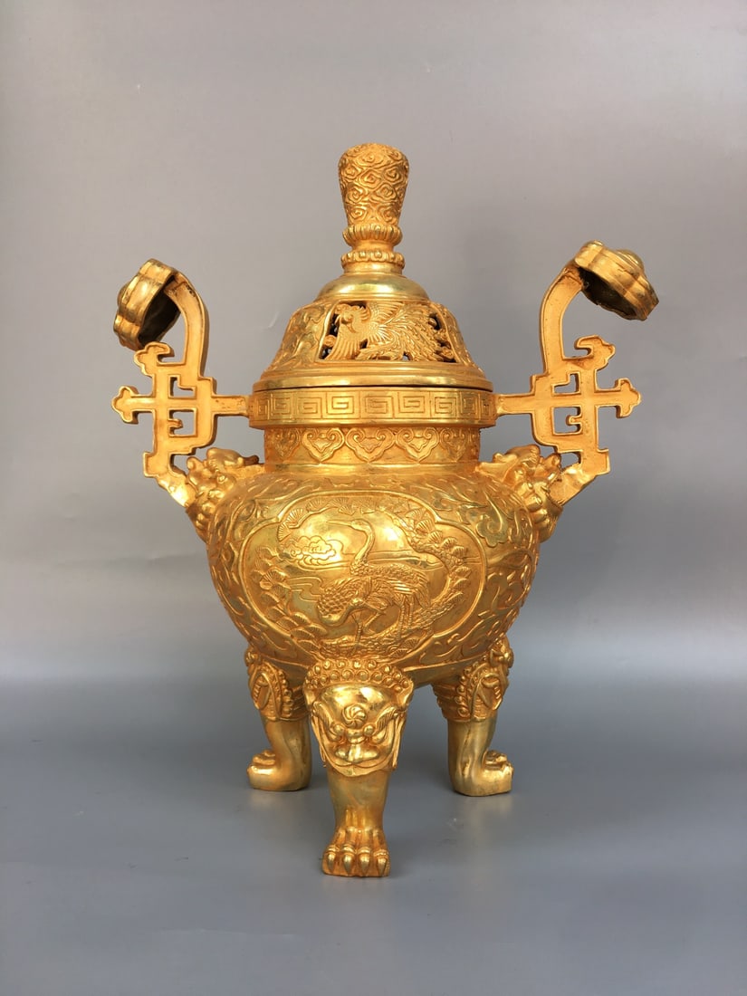 Golden Lion Leg Incense Burner: This golden lion-leg incense burner is exquisitely crafted with a thick patina. It measures 32cm in width, 40cm in height, and 16cm in thickness, and weighs approximately 4200g. Provenance:Private col