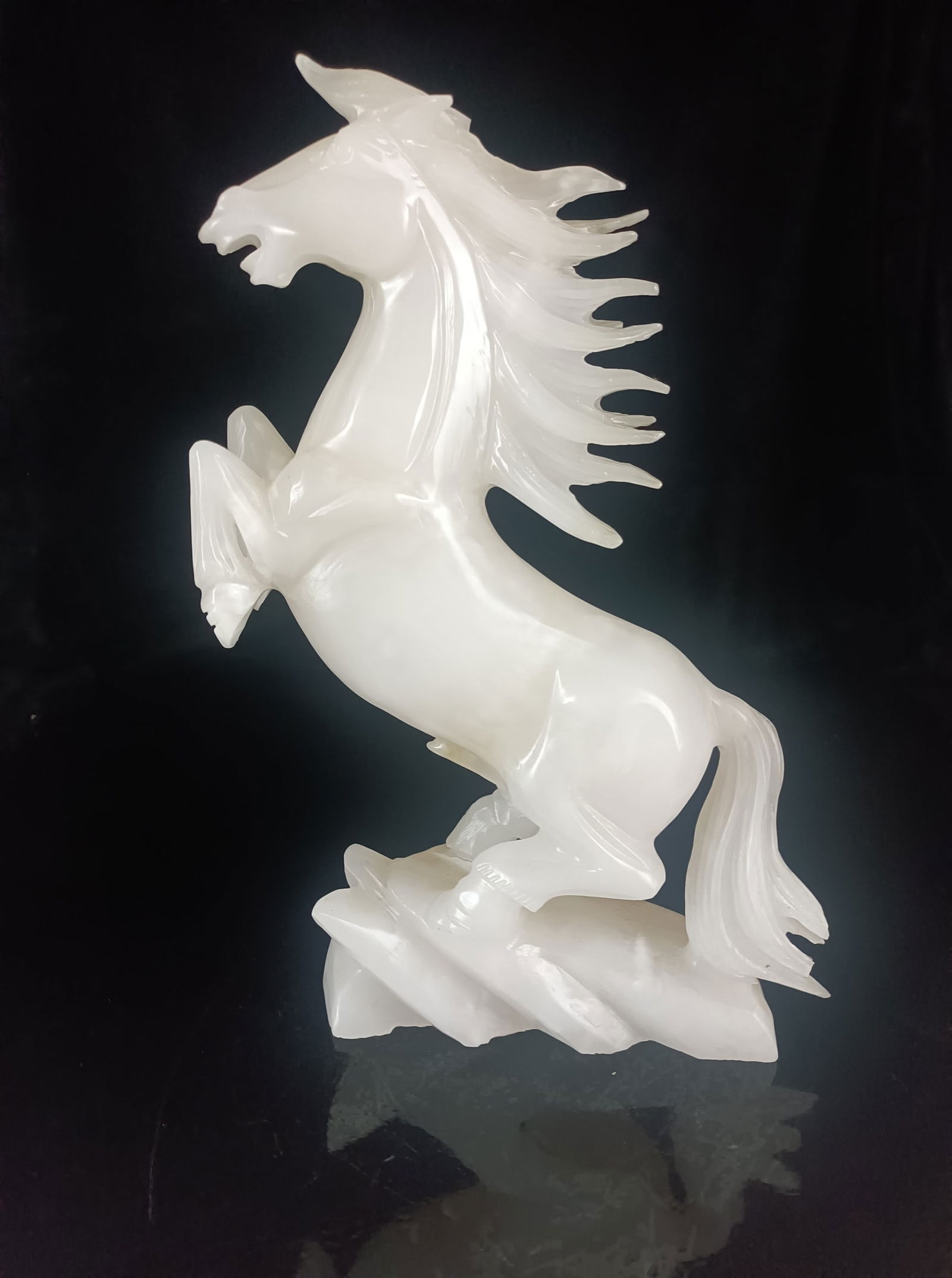 Fine Hetian jade horse galloping ornament: This exquisite Hetian jade horse galloping ornament is made of white, lustrous, and delicate jade. It measures 32 cm in height and 20 cm in width, and weighs 6.44 catties. Provenance:Private collectio