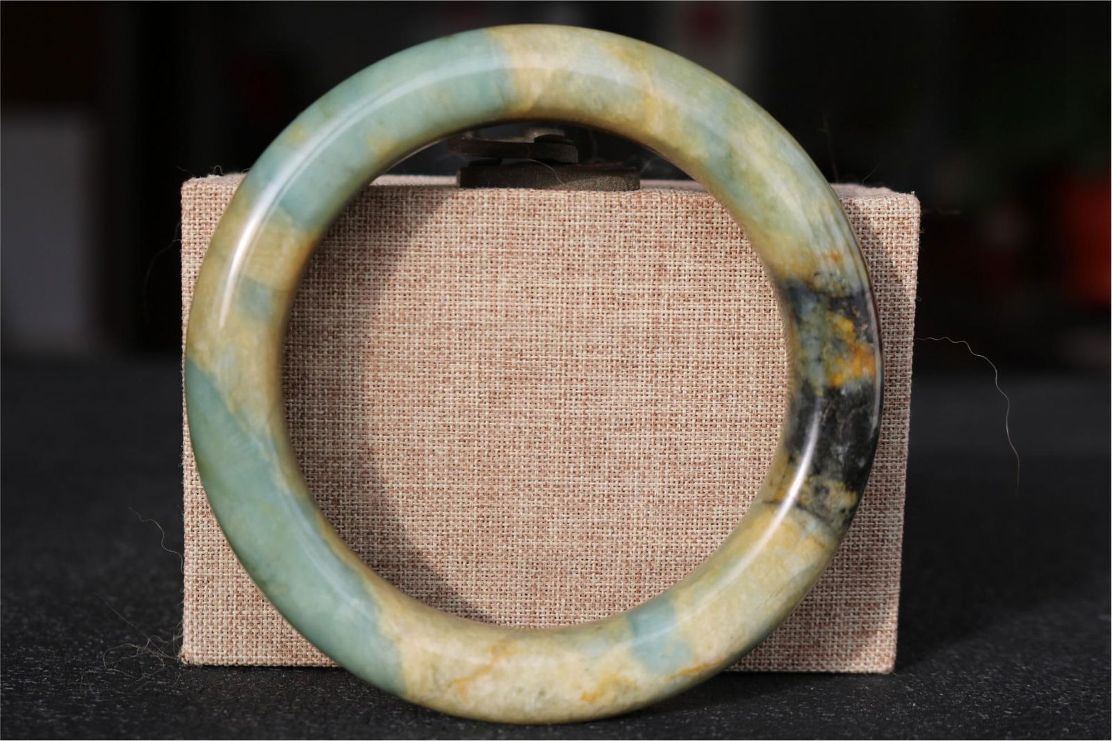 Tang tri-color jade bracelet: Tang Dynasty tri-colored jade bracelet, 60.2 cm wide, 59.74 cm inner diameter, weighing 63 g. Provenance:Private collection from a professor in University of Glasgow. Our cooperative logistics service