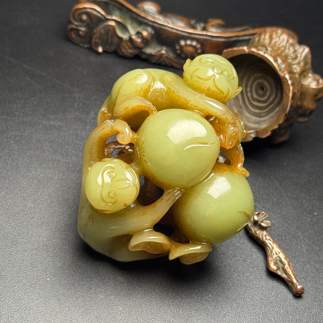 Old Yellow Jade Monkey: The old yellow jade monkey, symbolizing longevity and good fortune, is depicted with a full and vivid carving. The jade is warm and lustrous with a well-developed patina. Dimensions: 73x58x40mm; Weigh