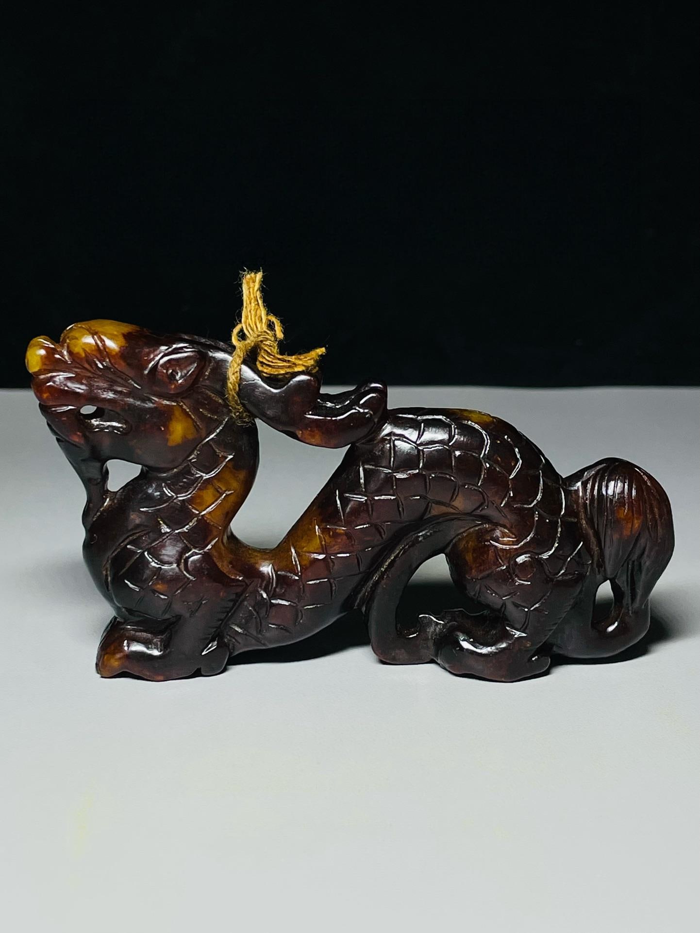 Exquisitely carved dragon-shaped ornament from ancient Hetian jade, from a long-standing collection. (1 of 6)