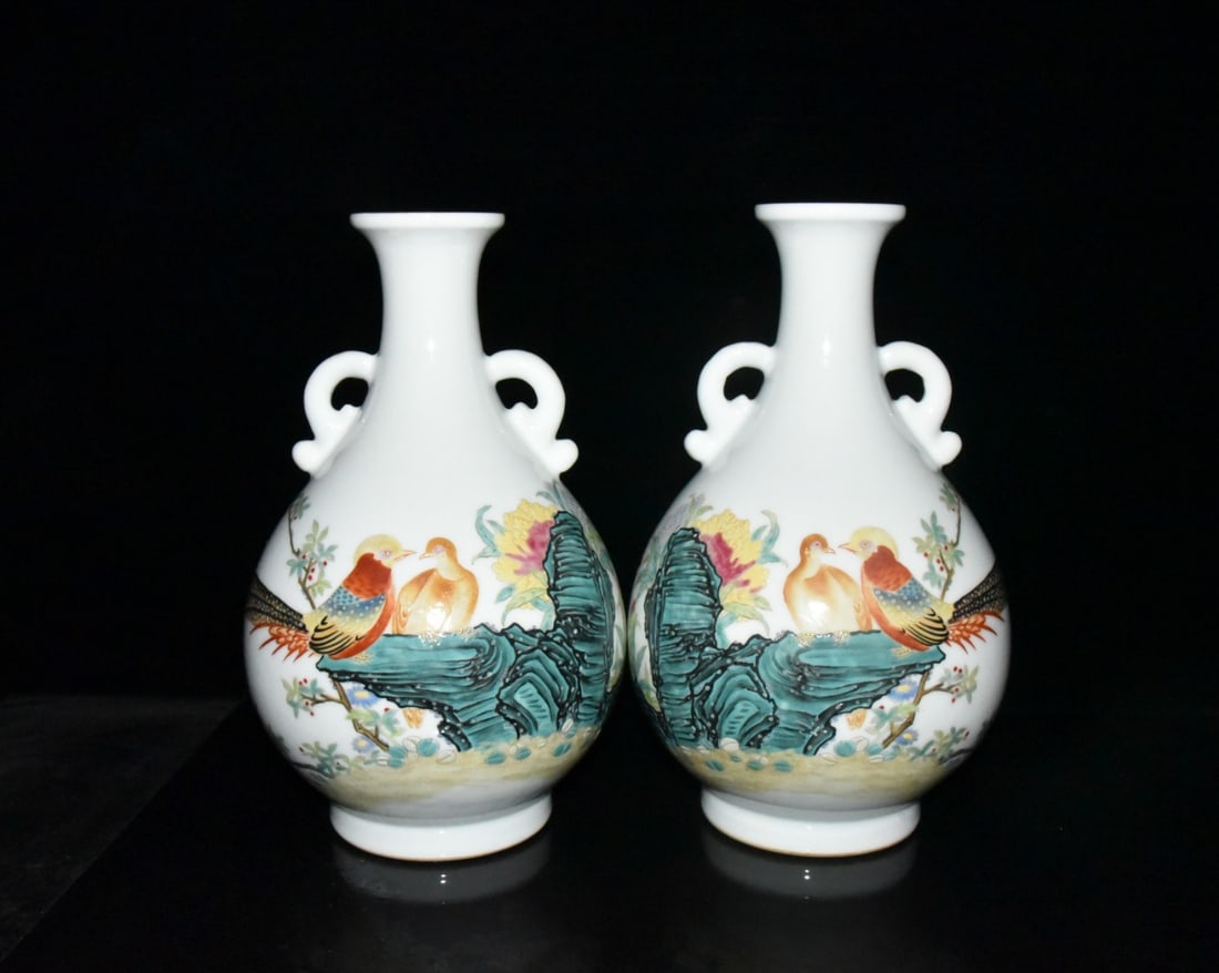 A pair of Qing Dynasty Yongzheng period Guyuexuan enamel-painted flower and bird pattern: A pair of Qing Dynasty Yongzheng period Guyuexuan enamel-painted flower and bird pattern double-eared vases, 29.5 x 18 cm. Provenance:From an old private collection in Cotswold, United Kingdom.? Our c