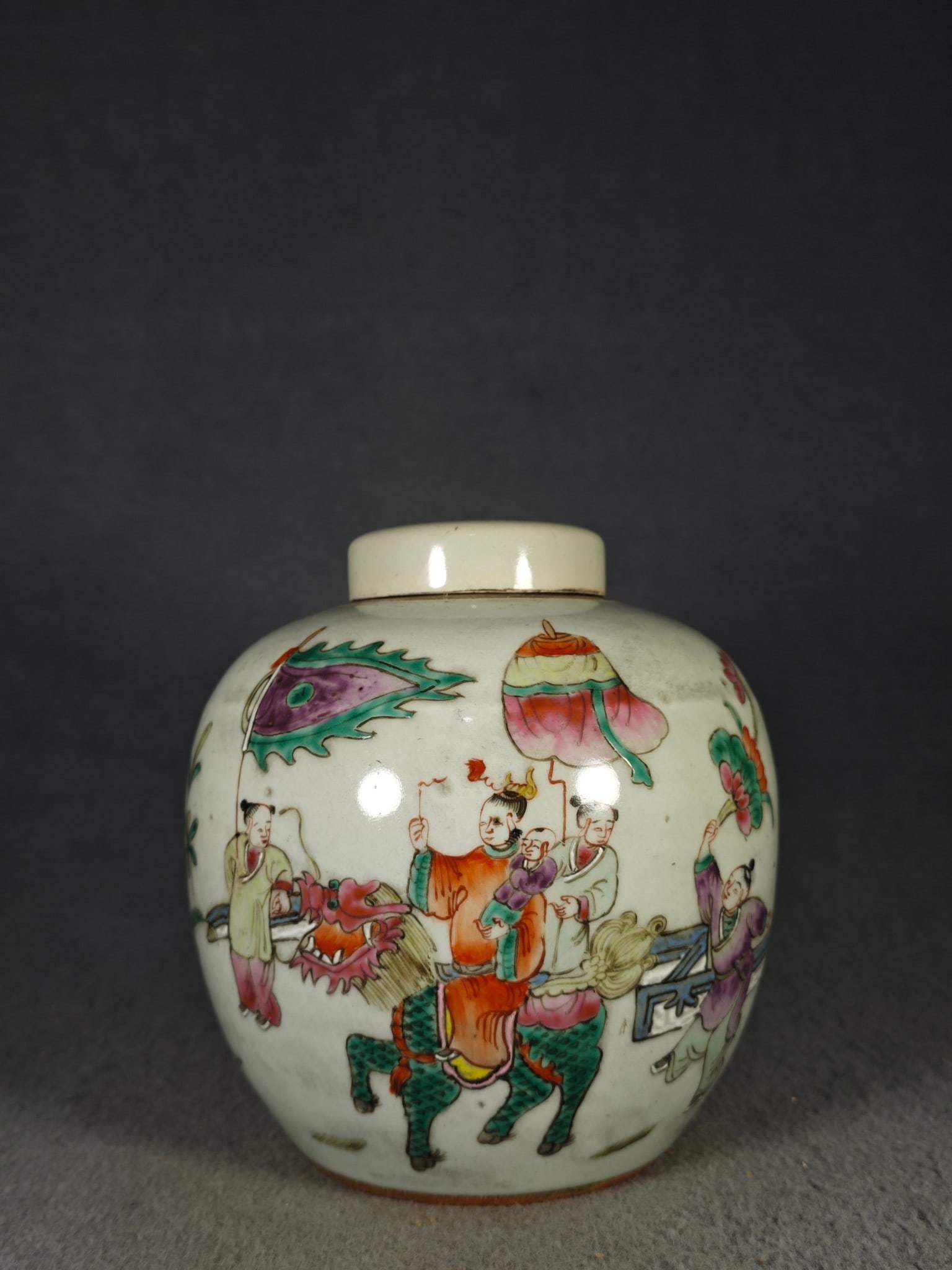 A famille rose covered jar depicting a mythical creature, Qilin (a mythical creature), delivering a (1 of 7)