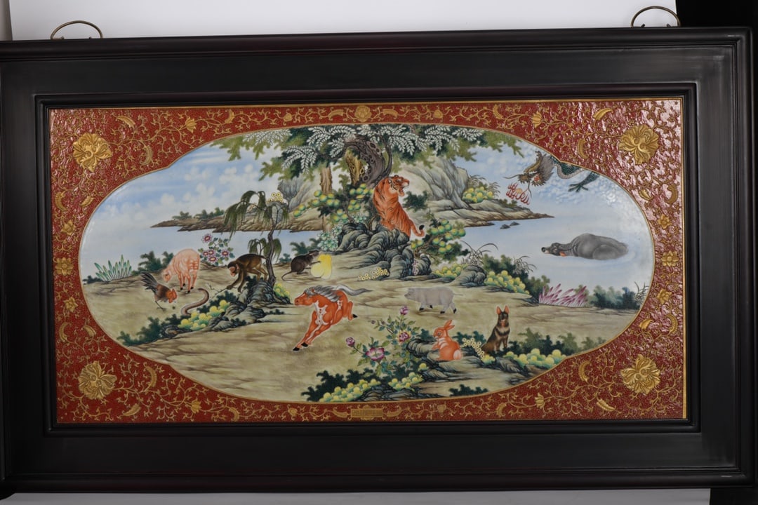 Qing Dynasty, Qianlong Period, Enamelled, Carved, and Gilded Porcelain Plaque with Twelve Zodiac: A porcelain plaque depicting the twelve Chinese zodiac animals with enamel carving and gilt decoration, dating from the Qianlong period of the Qing dynasty. 133 cm long and 78.5 cm wide. Provenance:Pr