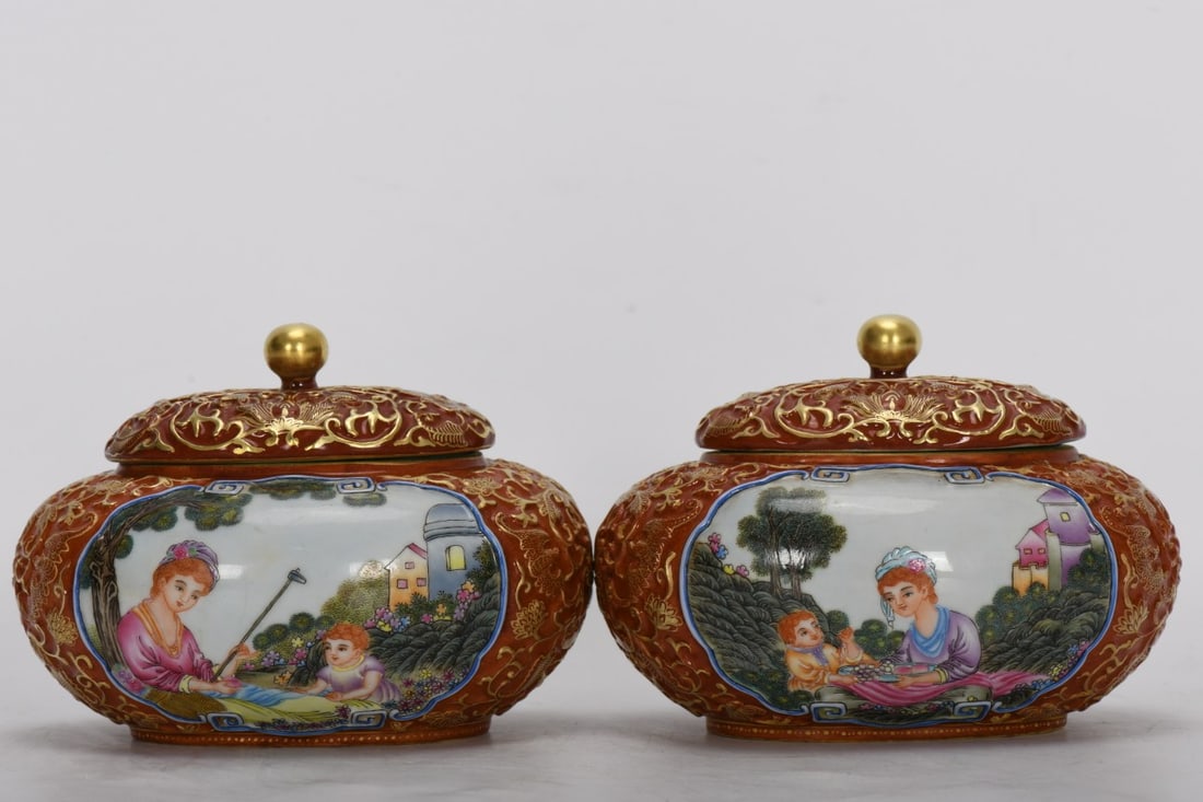 A Qing Dynasty Qianlong period enamel-painted and gilded covered jar with Western figures and: A Qing Dynasty, Qianlong period, enamel-painted, carved and gilded covered jar with Western figures in a window, 9.5 cm high, 8.8 cm in mouth diameter, 10.7 cm in belly diameter, and 6.1 cm in base di