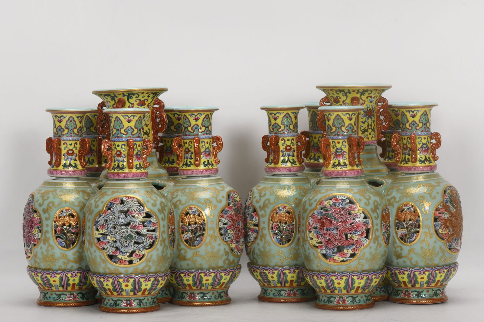 A celadon-glazed, openwork, gilt-decorated six-tube revolving vase from the Qianlong period of the: A celadon-enamel, celadon-glazed, openwork, gilt-decorated six-tube revolving vase from the Qianlong period of the Qing dynasty. Height: 26 cm, mouth diameter: 9.5 cm, belly diameter: 26.5 cm, base di