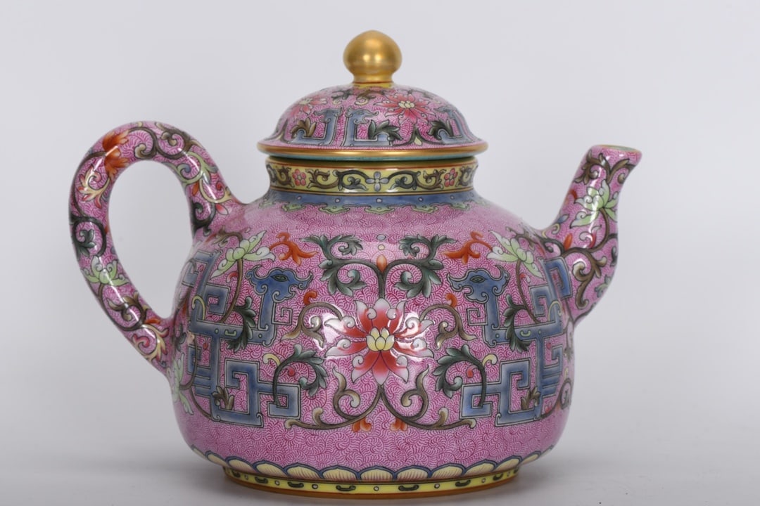 A famille rose phoenix-tail teapot from the Qianlong period of the Qing dynasty. (1 of 8)