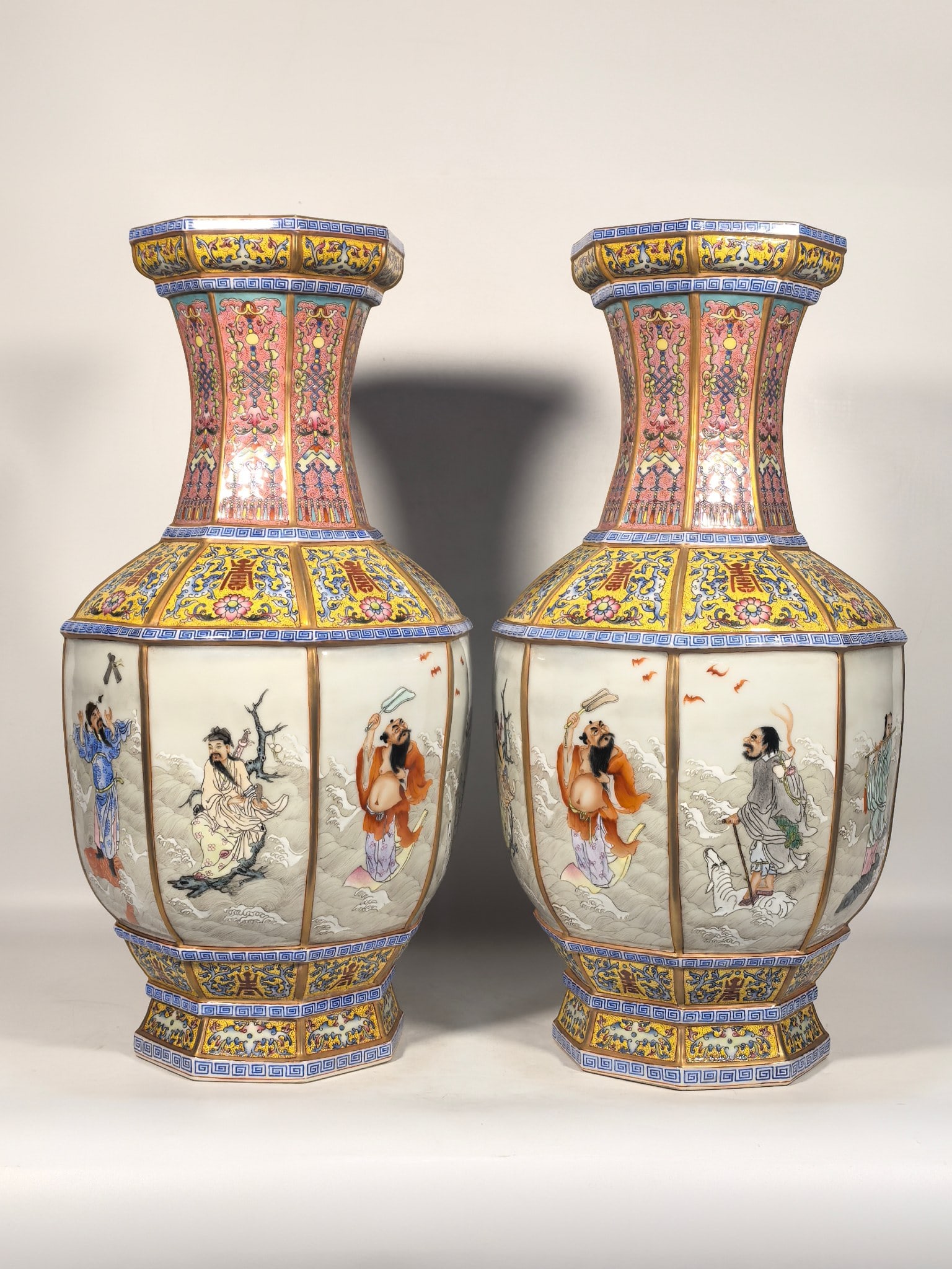 A Qing Dynasty Qianlong period enamel-painted vase with phoenix tail grass and eight immortals: A Qing Dynasty, Qianlong period, famille rose enamel vase with phoenix tail grass and eight immortals design, 46 cm high, 14 cm in diameter at the mouth, 25 cm in diameter at the belly, and 15 cm in d