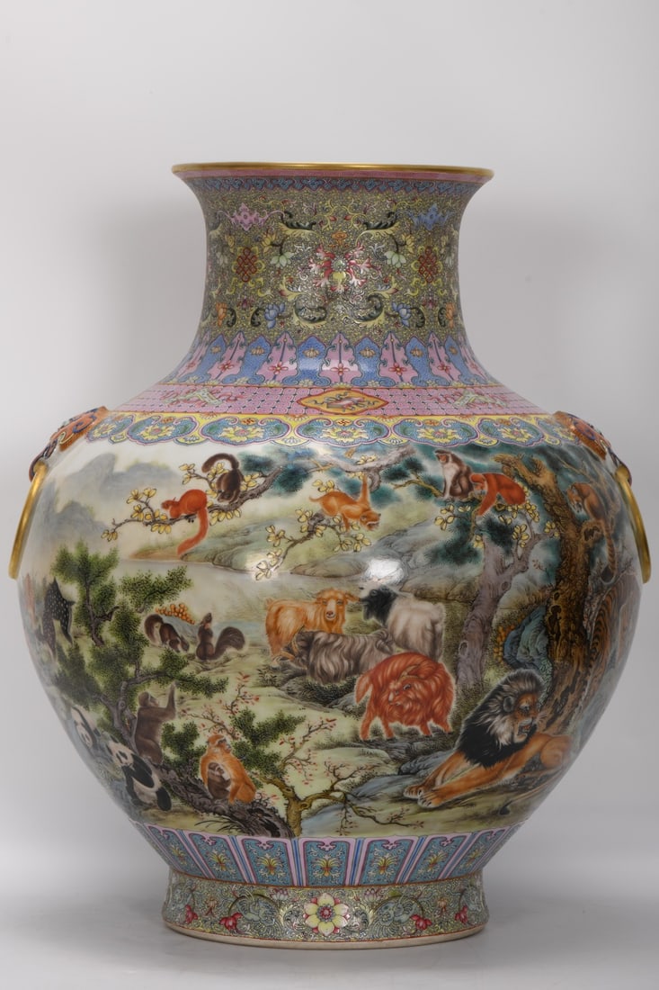 A large-mouthed vase with double handles and decorated with enamel decoration by Gu Yue Xuan, dating: A large-mouthed vase with double handles and decorated with enamel painting of beasts from the Guyuexuan style, dating from the Qianlong period of the Qing dynasty. Height: 49.5 cm, mouth diameter: 20