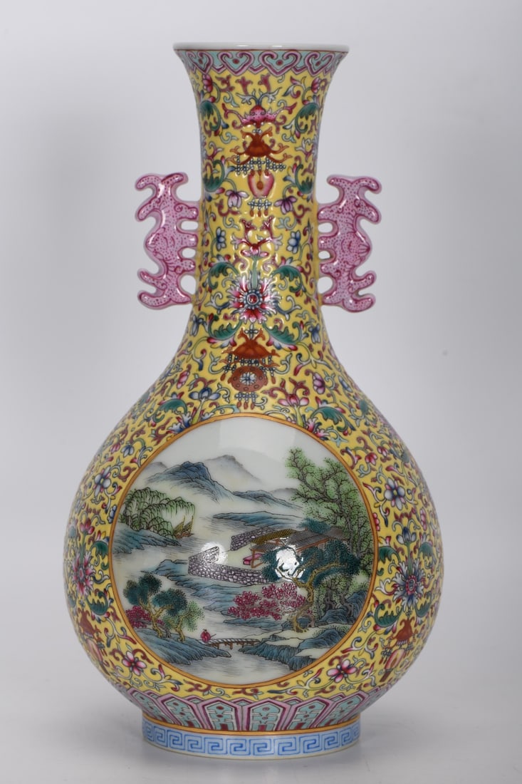 A Qing Dynasty Qianlong period famille rose enamel vase with a yellow ground and openwork landscape (1 of 9)