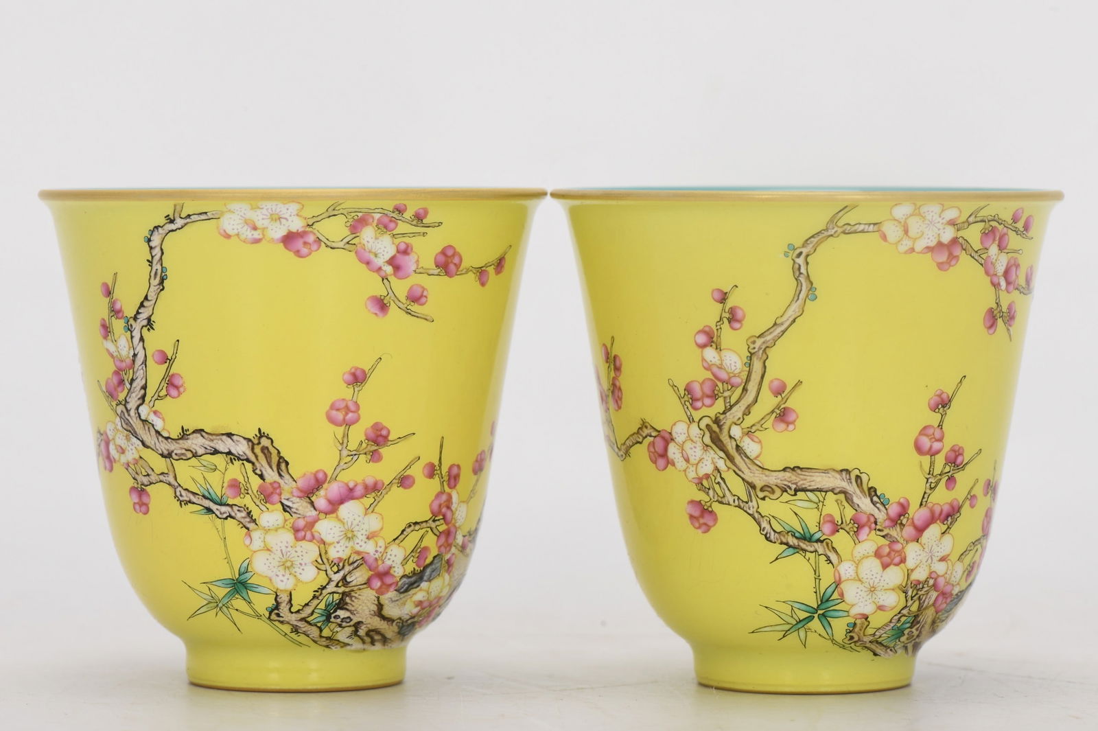 A Qing Dynasty Qianlong period enamel-painted plum blossom cup on a yellow ground. (1 of 8)