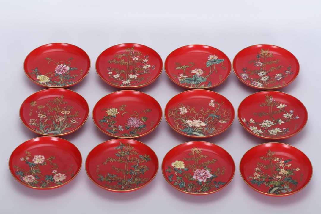 A Qing Dynasty Qianlong period enamel-painted dish with chili-red and gold-painted twelve flower: A Qing Dynasty, Qianlong period, enamel-painted dish with chili-red chili-red enamel and gold decoration depicting twelve flower goddesses, 2.5 cm high, 12.5 cm in diameter at the mouth, and 6.9 cm in