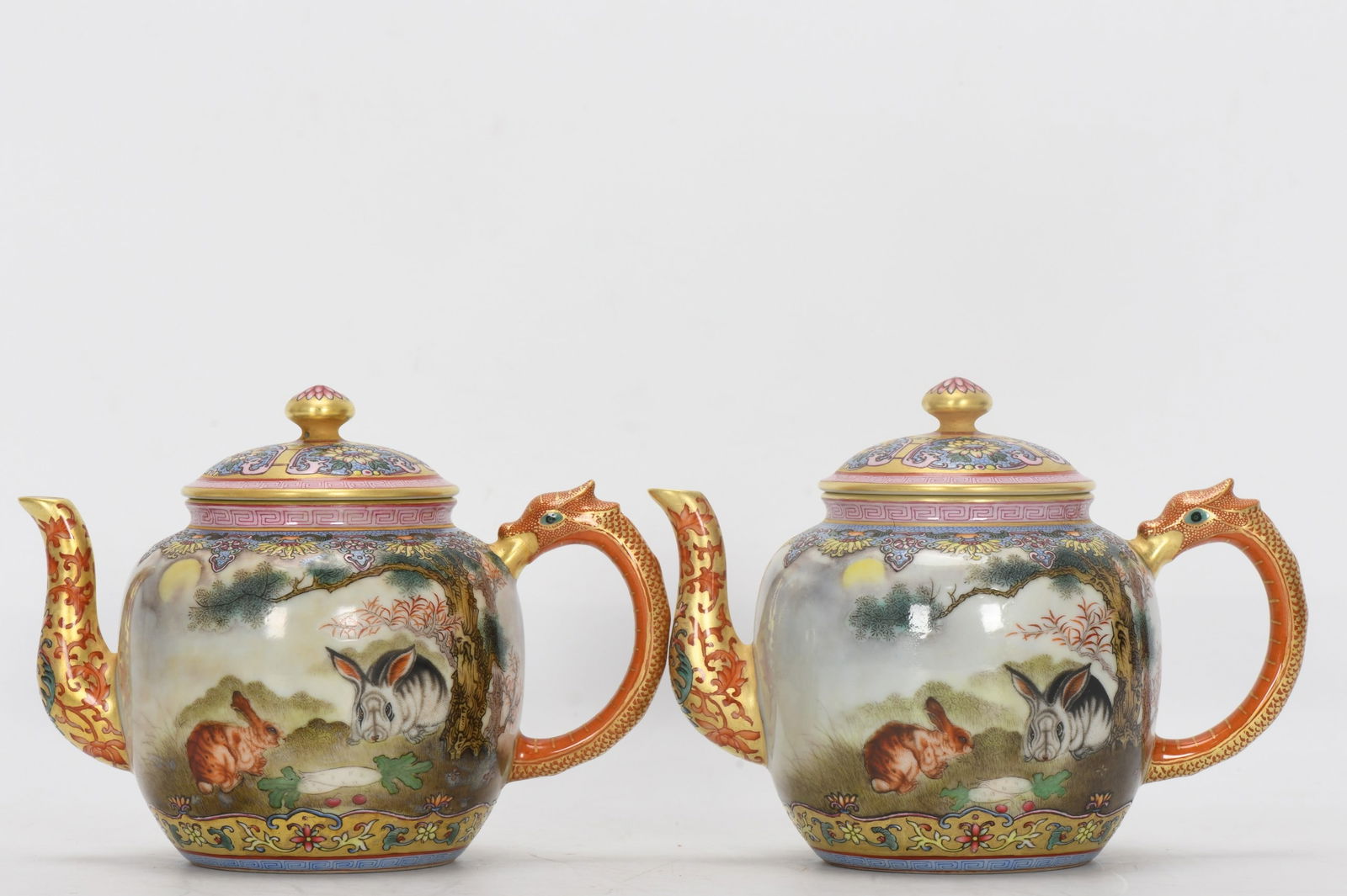 A Qing Dynasty Qianlong period enamel-painted animal-shaped teapot with inscriptions. (1 of 9)