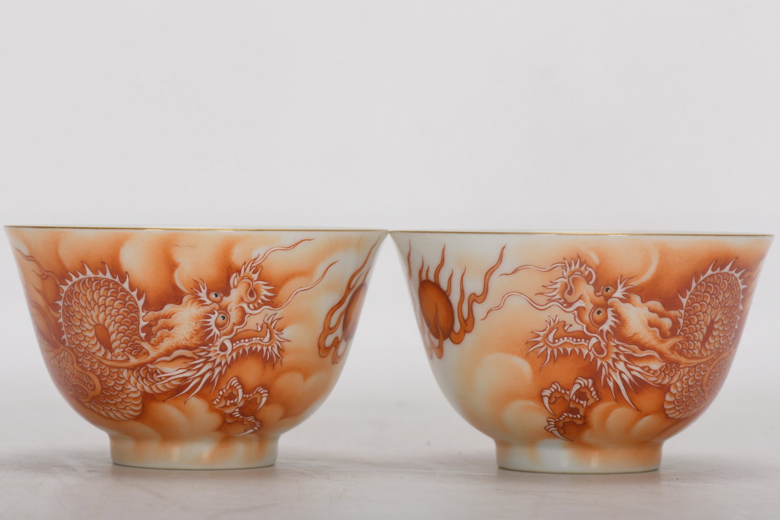 Qing Dynasty, Yongzheng Period, Enamel-painted Dragon and Cloud Cup: Qing Dynasty, Yongzheng period, Enamel-painted dragon and cloud cup, 5.5 cm high, 9 cm in diameter at the mouth, 3.8 cm in diameter at the base. Provenance:Private collection from a professor in Unive