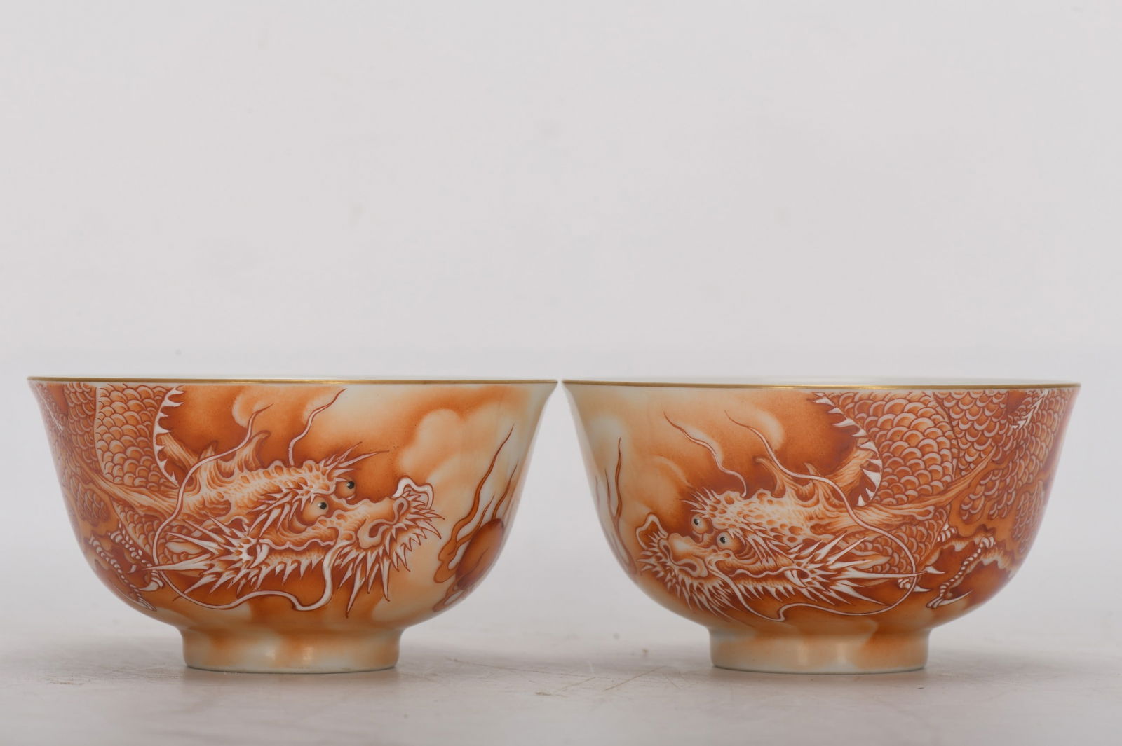 Qing Dynasty, Yongzheng Period, Enamel-painted Dragon and Cloud Cup: Qing Dynasty, Yongzheng period, enamel-painted, iron-red cloud and dragon three-figure cup, 5 cm high, 9.2 cm in diameter at the mouth, and 3.8 cm in diameter at the base. Provenance:Private collectio