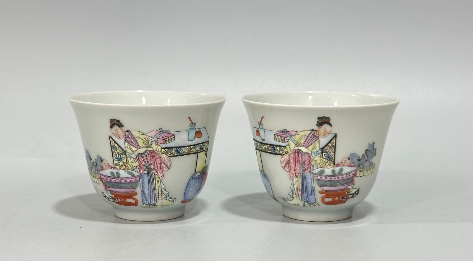 A pair of famille rose cups depicting the story of "Three Mothers Teaching Their Sons" from the (1 of 9)