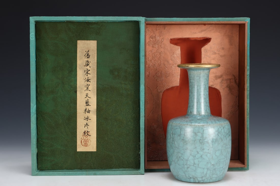 Formerly in the collection of a Song Dynasty Ru ware sky-blue glazed mallet-shaped vase: A Song Dynasty Ru ware sky-blue glazed incense burner with two handles, formerly in the collection. Dimensions: Height: 7.7 cm; Diameter: 16 cm. Provenance:An old private collection in Scotland, Unite