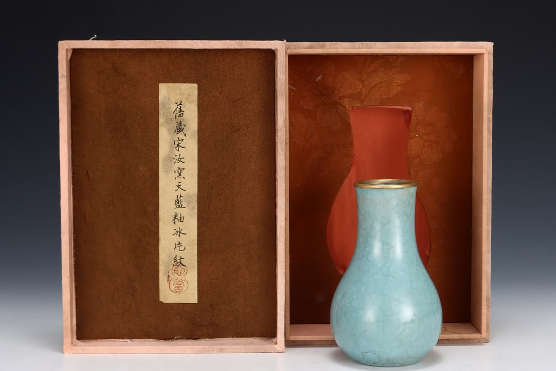 Formerly in the collection of a Song Dynasty Ru ware sky-blue glazed straight-necked vase: A Song Dynasty Ru ware sky-blue glazed straight-necked vase, formerly in the collection. Dimensions: Height: 13.2 cm; Diameter of belly: 8.3 cm. Provenance:A notable private collector in Kensington, L