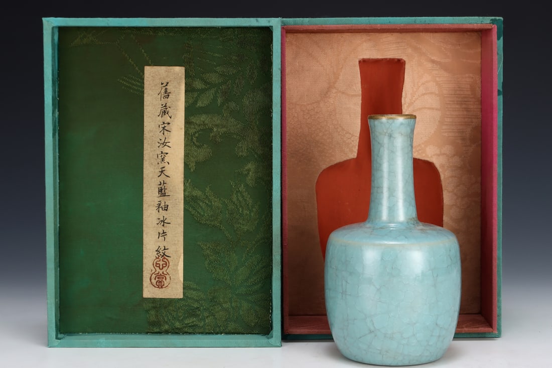 Formerly in the collection of a Song Dynasty Ru ware sky-blue glazed mallet-shaped vase: A Song Dynasty Ru ware sky-blue glazed mallet-shaped vase, formerly in the collection. Dimensions: Height: 16.8 cm; Diameter: 9.5 cm. Provenance:A notable private collector in Kensington, London, Unit