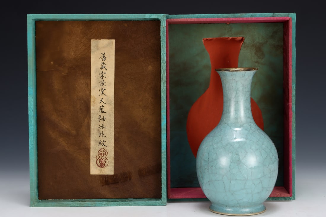 Formerly in the collection of a Song Dynasty Ru ware sky-blue glazed goose-neck vase: A Song Dynasty Ru ware sky-blue glazed goose-neck vase, formerly in the collection. Dimensions: Height: 17.5 cm; Diameter: 9.8 cm. Provenance:A notable private collector in Kensington, London, United