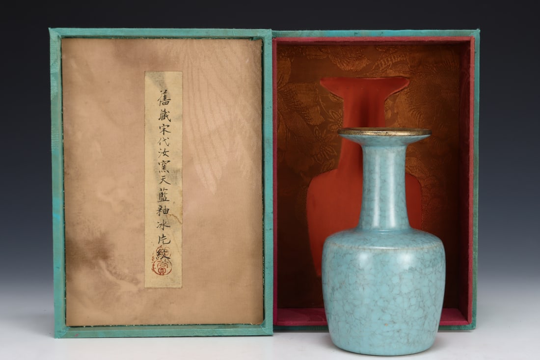 Formerly in the collection of a Song Dynasty Ru ware sky-blue glazed mallet-shaped vase: A Song Dynasty Ru ware sky-blue glazed mallet-shaped vase, formerly in the collection. Dimensions: Height: 16.7 cm; Diameter: 9.2 cm. Provenance:A notable private collector in Kensington, London, Unit