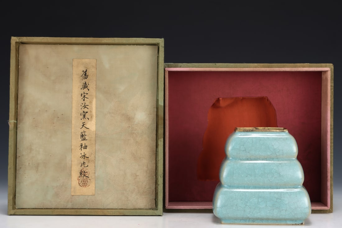 Formerly in the collection of a Song Dynasty Ru ware sky-blue glazed three-tiered square pot: A Song Dynasty Ru ware sky-blue glazed square vase with three tiers, formerly in the collection. Dimensions: Height: 11.5 cm; Diameter: 11.7 cm. Provenance:The Property of a Gentleman in Hampshire, Un